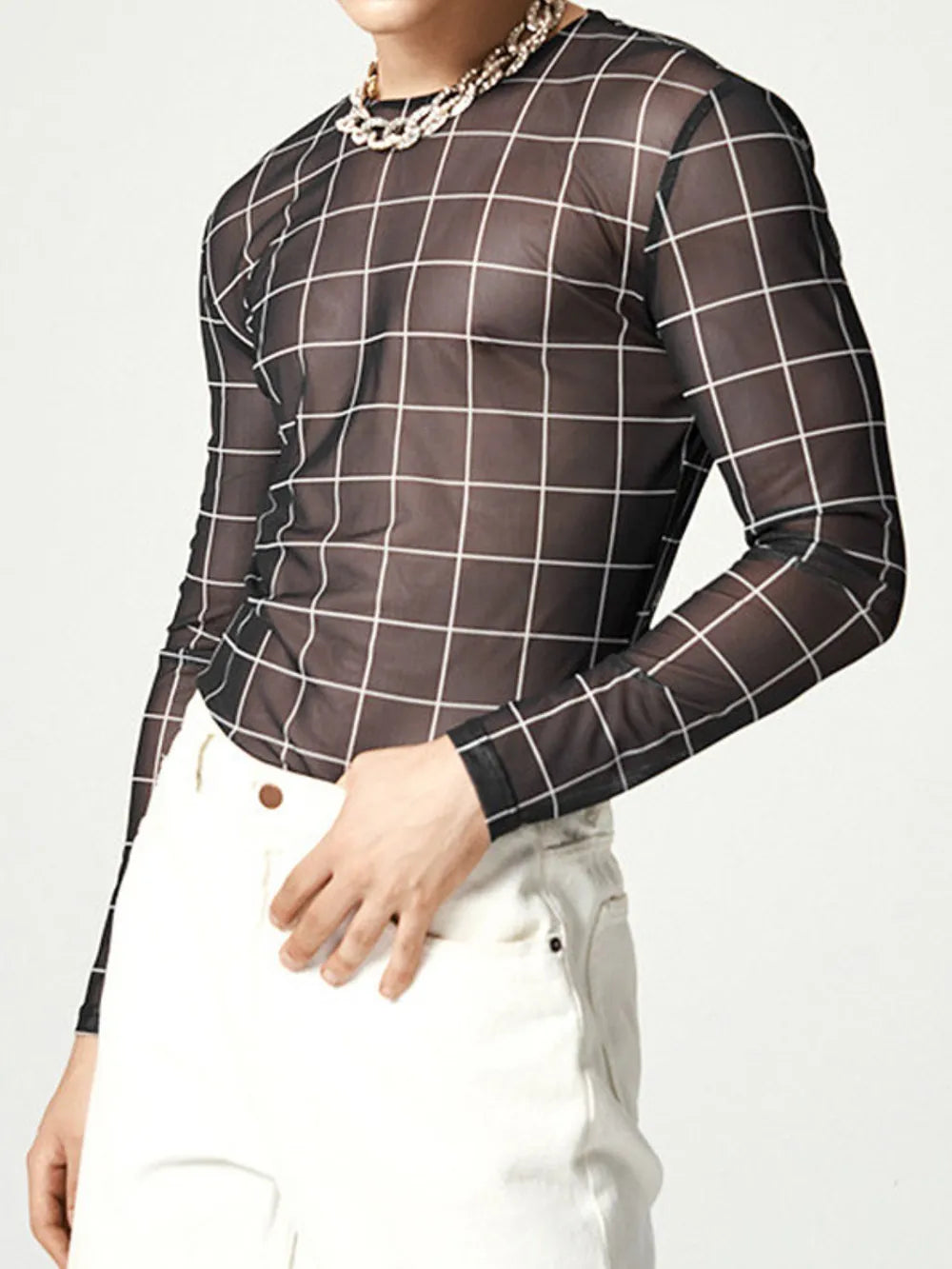 Black sheer mesh long sleeve top with white grid print and crew neck.