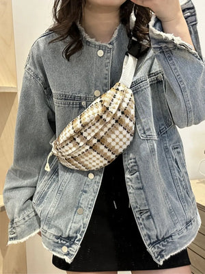 Textured houndstooth belt bag in beige and black with adjustable strap