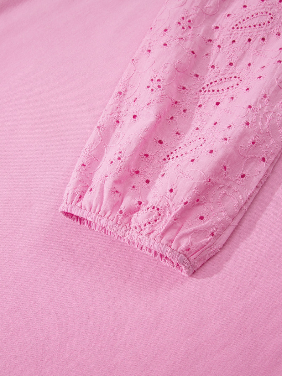 Pink cotton crew-neck sweatshirt with embroidered eyelet detail on the sleeve cuff.