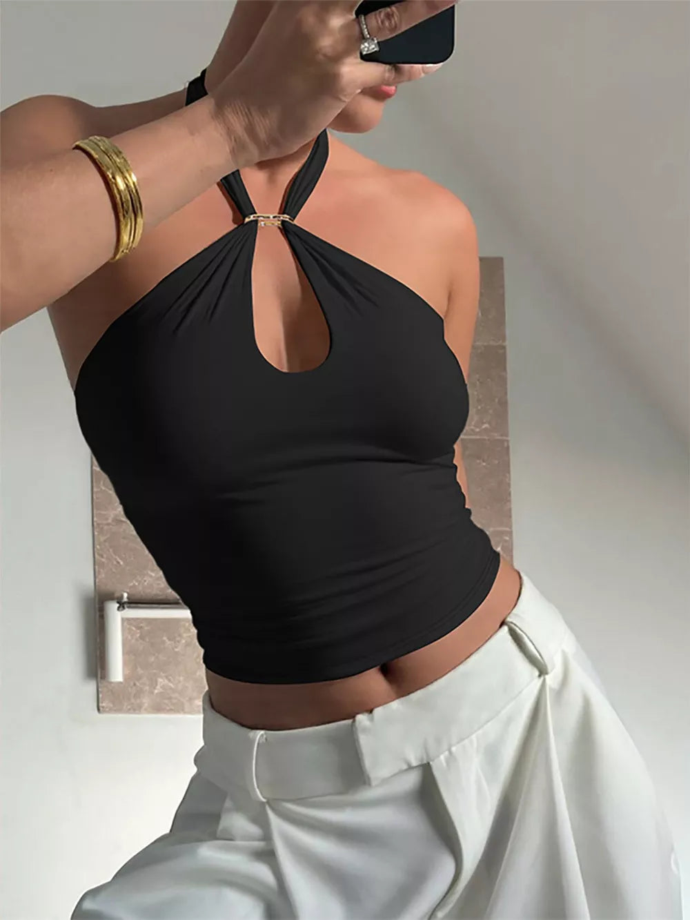 Black crisscross halter cami with keyhole accent and gold ring detail