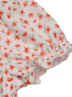 Floral mini dress with puff sleeves and ruffled cuffs.