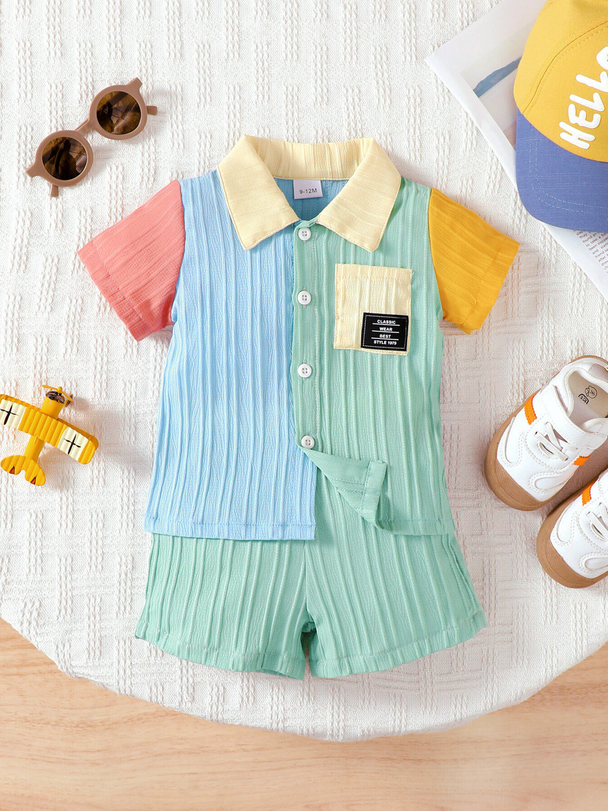 Baby color block button-down shirt and shorts set with pastel colors and textured fabric.