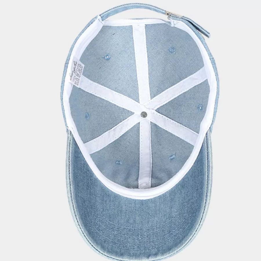 Light wash denim baseball cap with white interior lining and adjustable strap