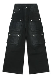 Dark denim wide-leg cargo pants with multiple utility pockets and silver button closures.
