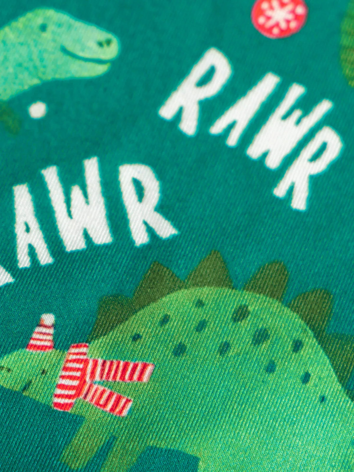 Dark green kids' pajamas with dinosaur print and "RAWR" text