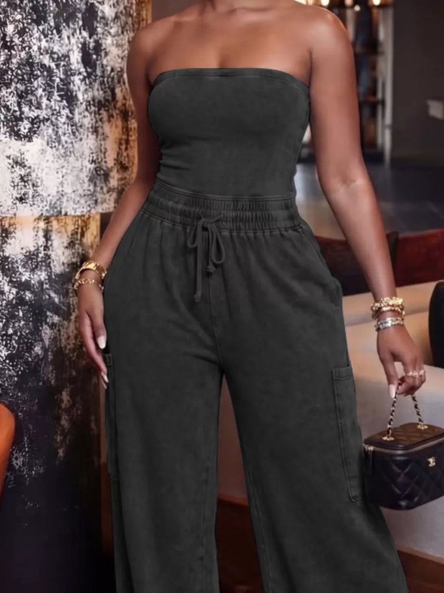 Black strapless jumpsuit with drawstring waist and cargo pockets