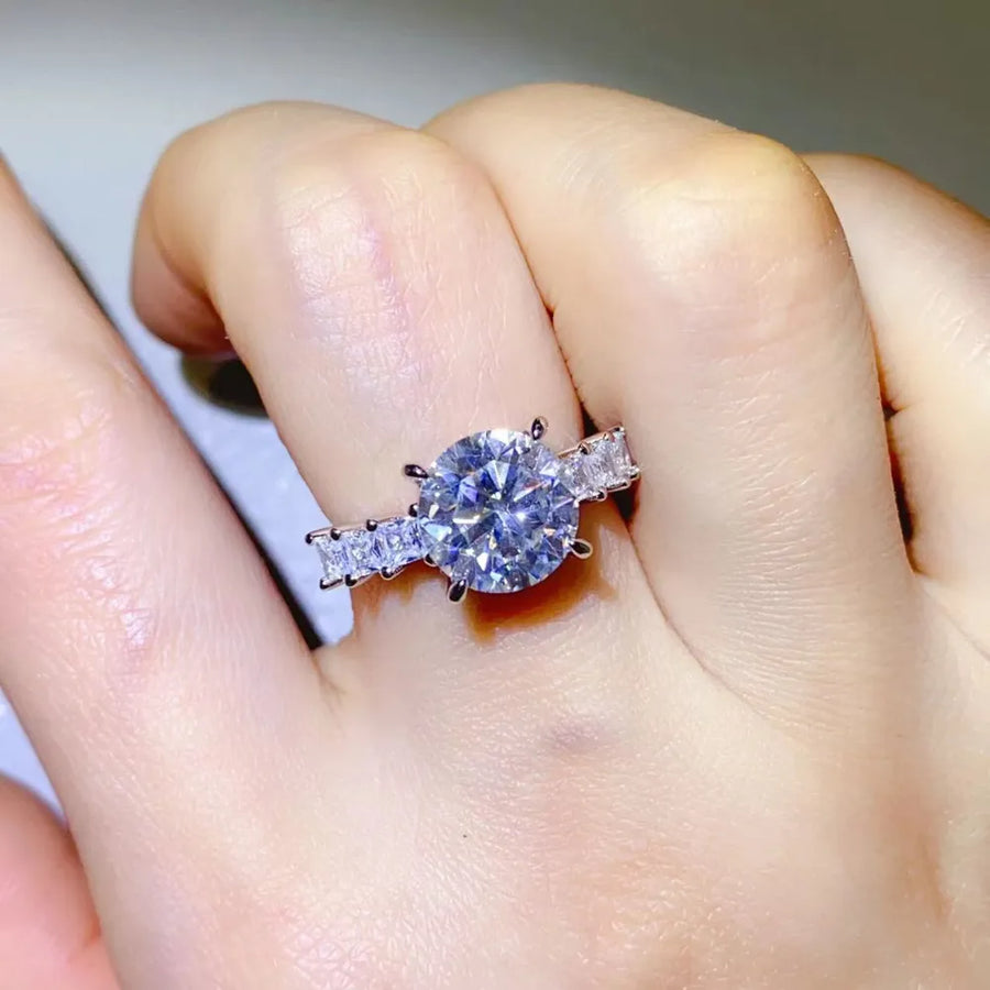 Radiant round moissanite and baguette ring in silver sterling silver.