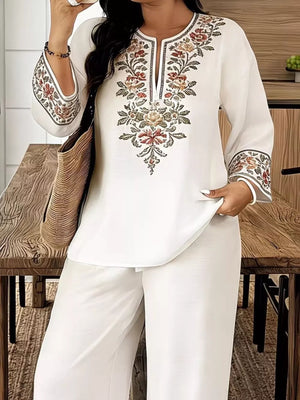 White embroidered tunic with floral detail and wide leg pants