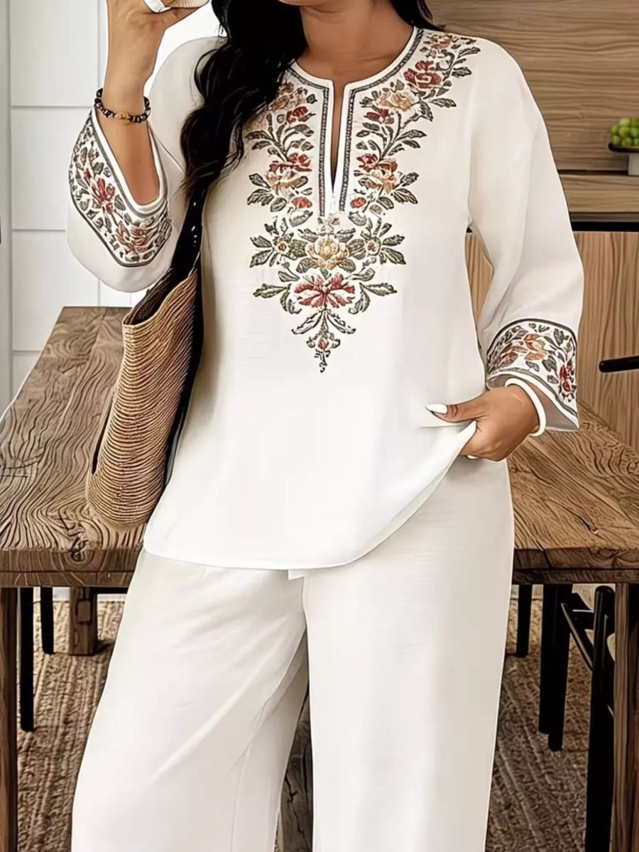 White embroidered tunic with floral detail and wide leg pants