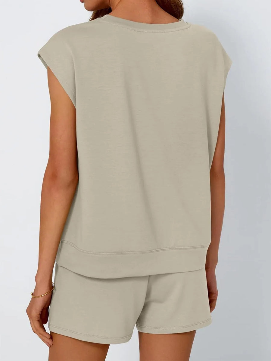 Khaki relaxed fit drawstring short set with sleeveless top and cuffed hem shorts.