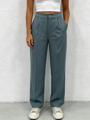 Chic high-waisted pleated maternity pants in slate blue with button closure and wide leg.