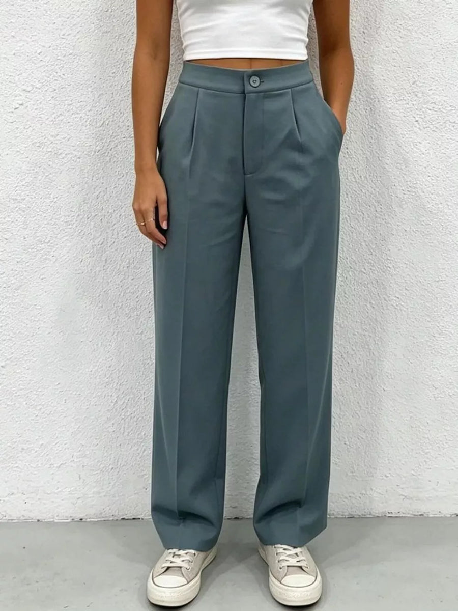 Chic high-waisted pleated maternity pants in slate blue with button closure and wide leg.