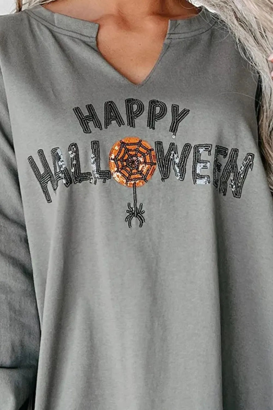 Gray Halloween graphic sweatshirt with sequin spiderweb and spider detail.