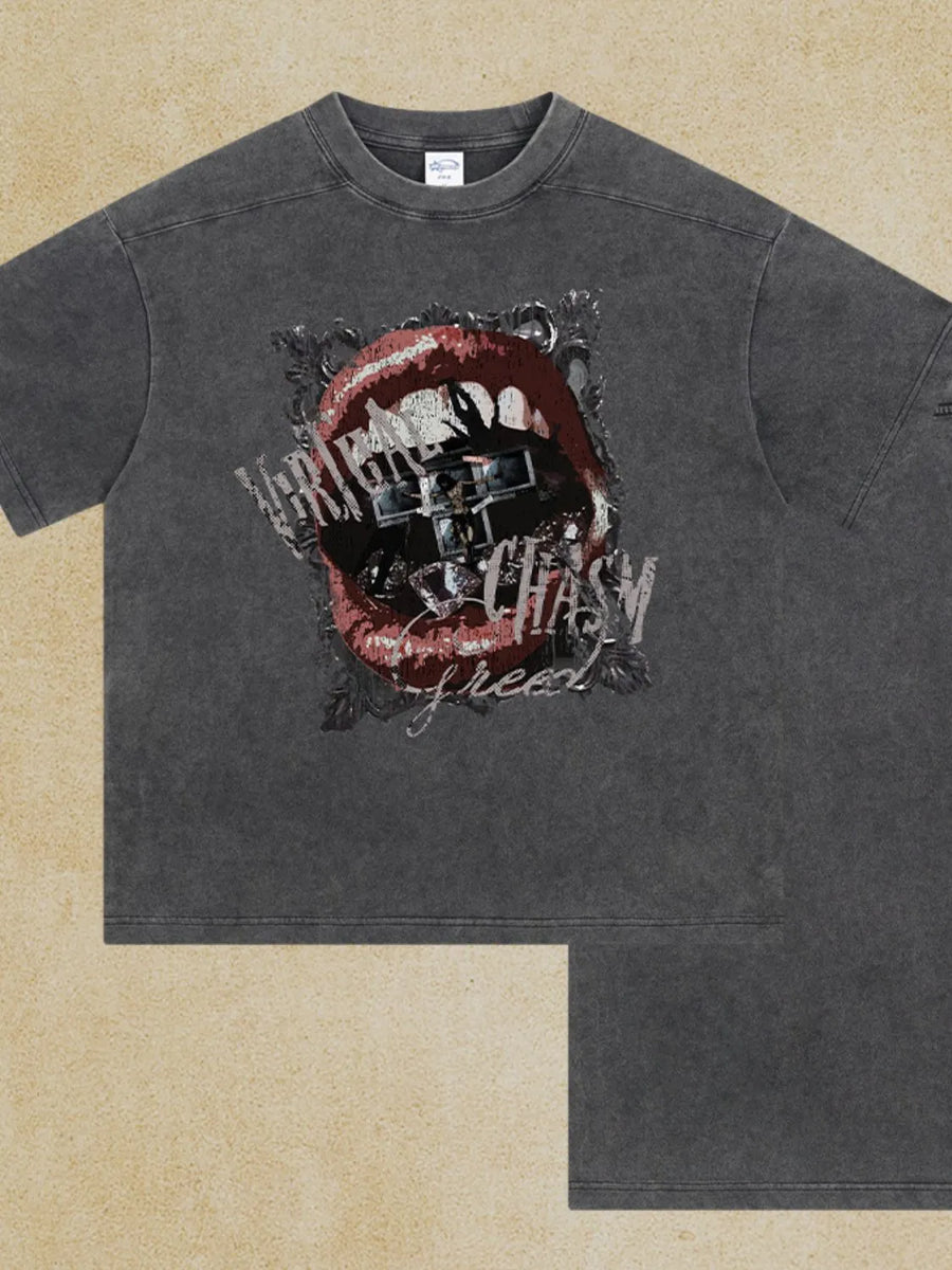 Graphic print washed cotton tee in dark gray with a bold lip graphic and text.