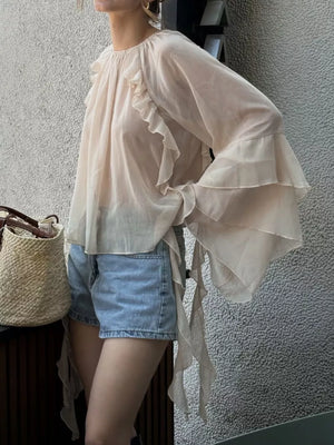 blouse in ivory featuring tied and loose fit