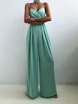 Mint green ruched spaghetti strap wide-leg jumpsuit with sweetheart neckline and flowing pants.