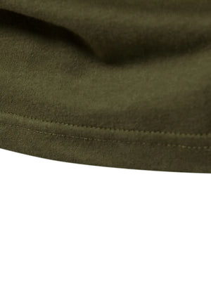 Army green raglan tee detail showing double-stitched hem and soft fabric texture.