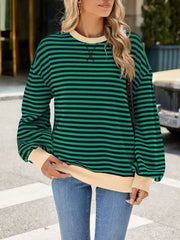 Striped crew neck sweatshirt in green and navy with cream trim and cuffs.
