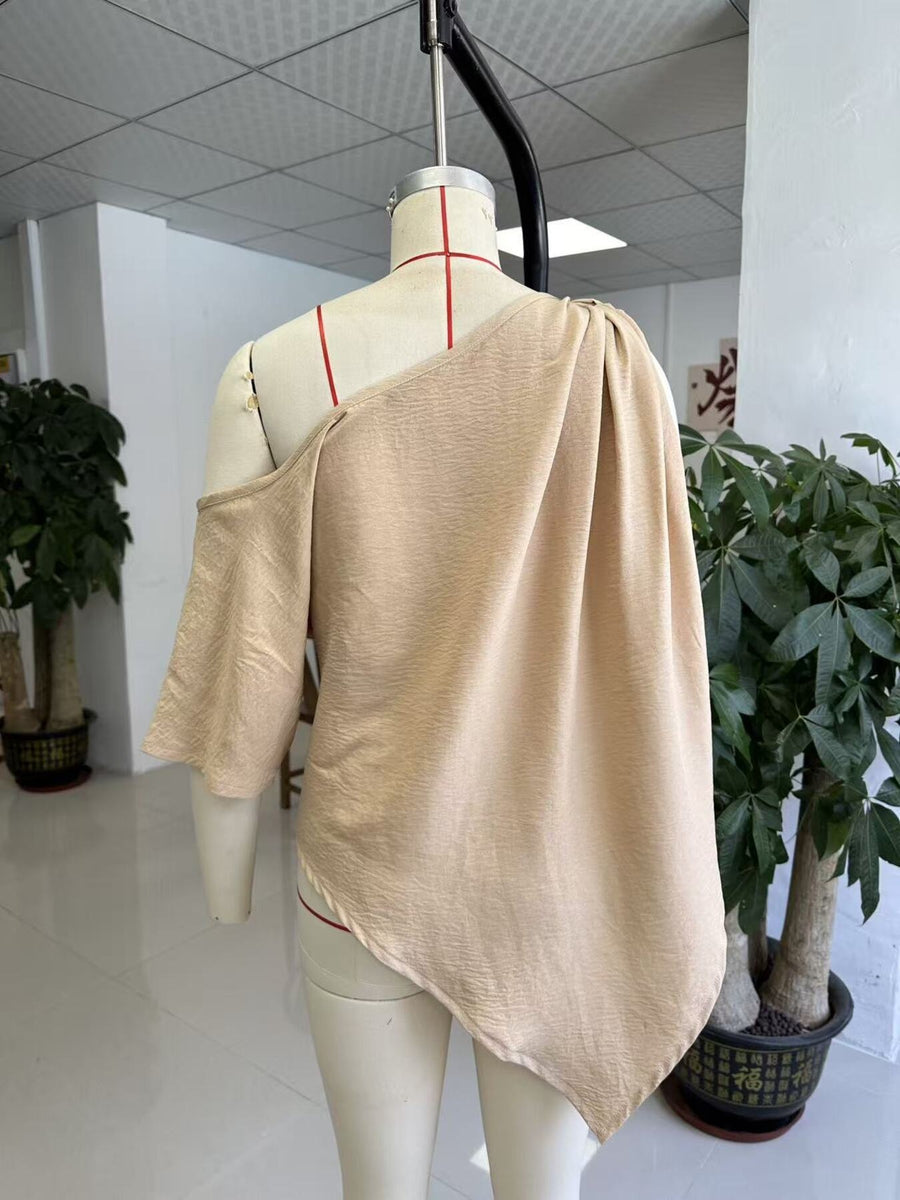 100% polyester Care instructions: Machine wash cold one-shoulder top in Black with relaxed silhouette