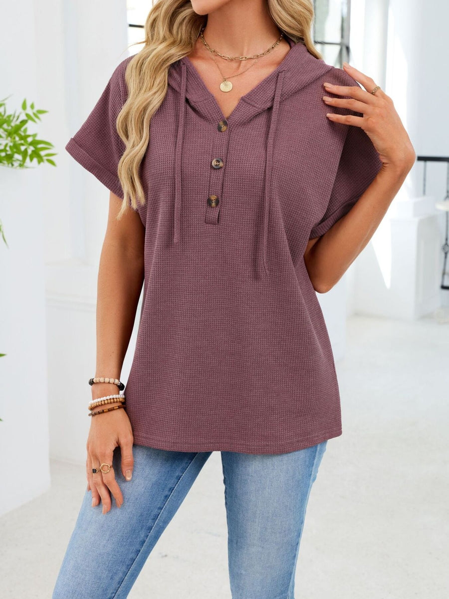 Waffle knit button hooded top in brick red with short sleeves and drawstring hood.