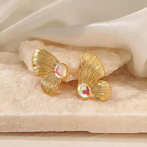 Gold earrings featuring gold-plated and textured