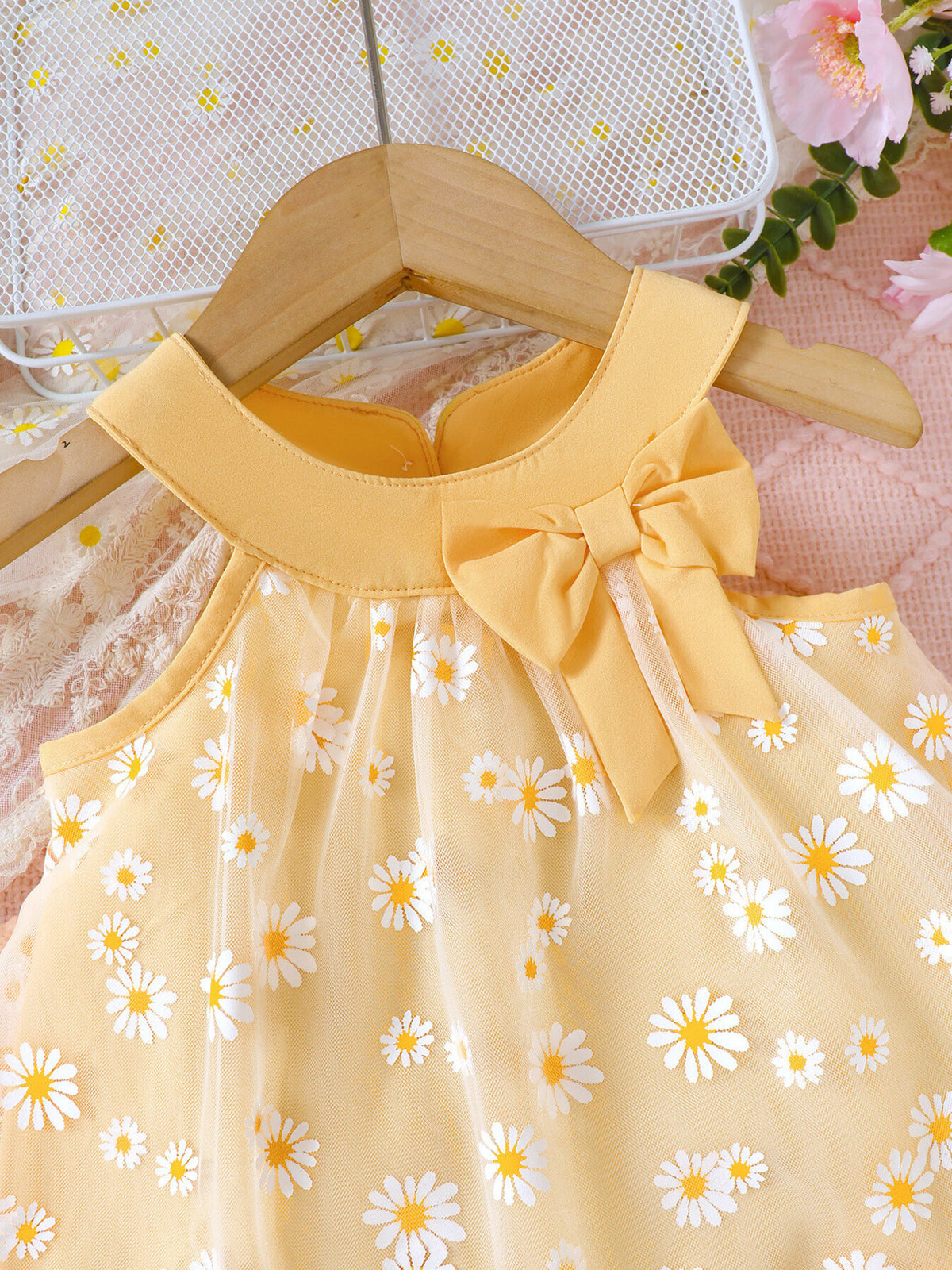 Yellow daisy print baby dress with bow detail and mesh overlay