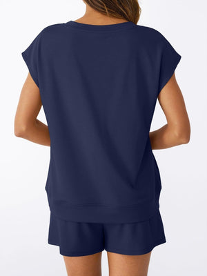 Navy V-neck top with cap sleeves and drawstring shorts set.