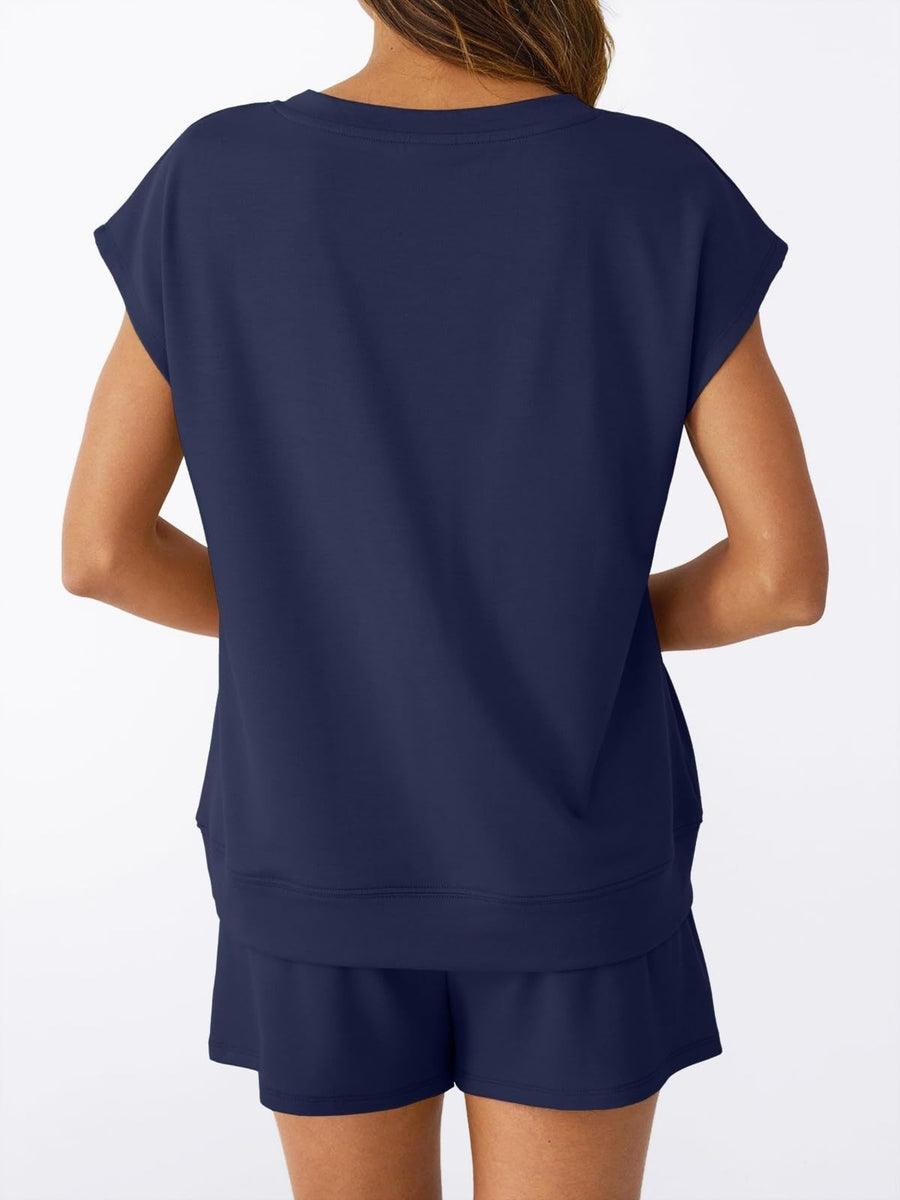 Navy V-neck top with cap sleeves and drawstring shorts set.