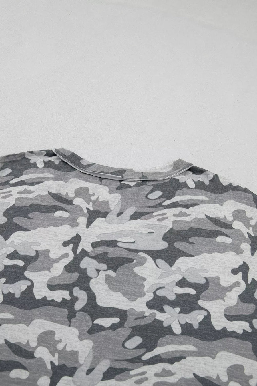 Camouflage V-neck relaxed tee with grey and black pattern