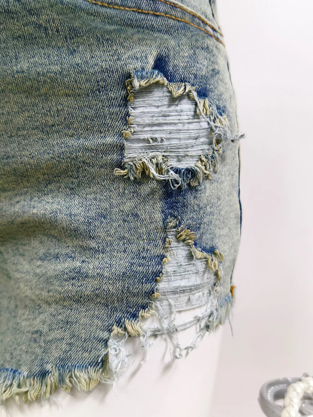 95% polyester, 5% elastane Care instructions: Machine wash cold denim shorts in Light with regular silhouette