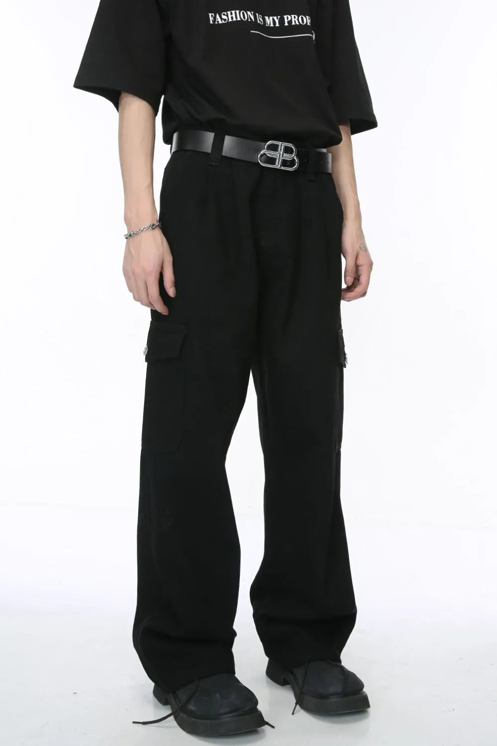 Black wide-leg cargo trousers with pleats and flap pockets.