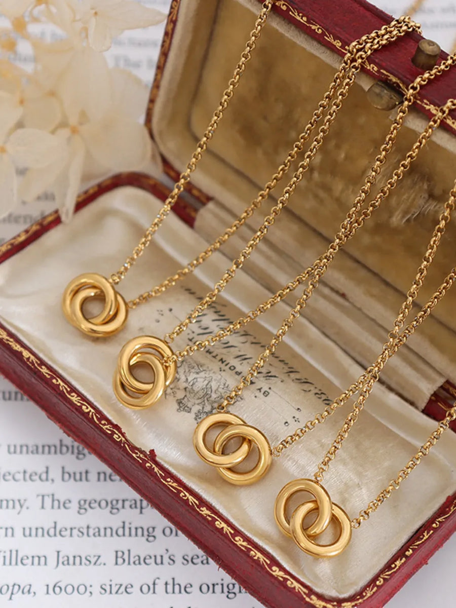 Gold interlocked circle pendant necklace with a delicate chain, 18K gold-plated.