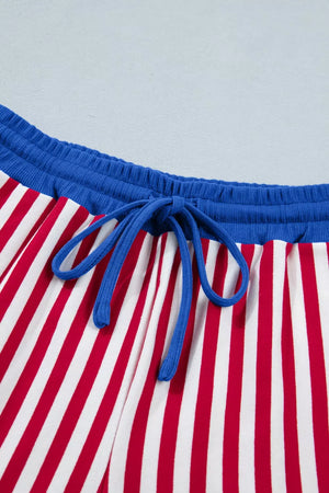 Red and white striped cotton lounge pants with blue drawstring and waistband.
