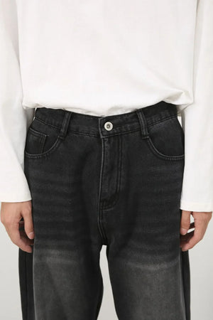 Oversized dark wash denim jeans with fade detail