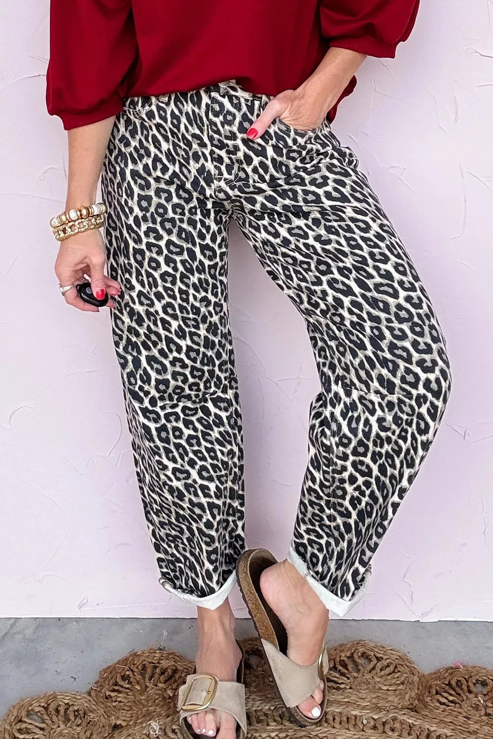 Chic cropped leopard print denim jeans with cuffed hems.