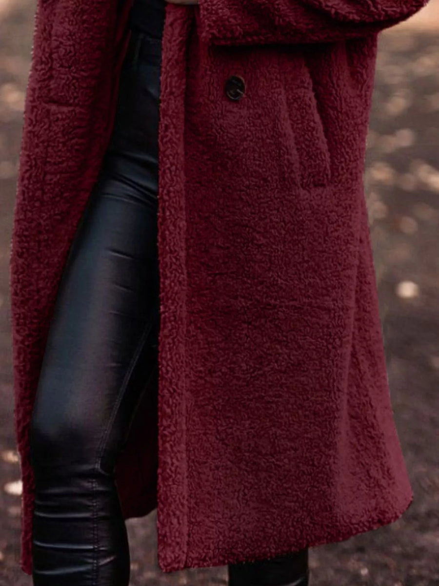 Wine Red teddy bear longline coat with button closure and pocket detail.