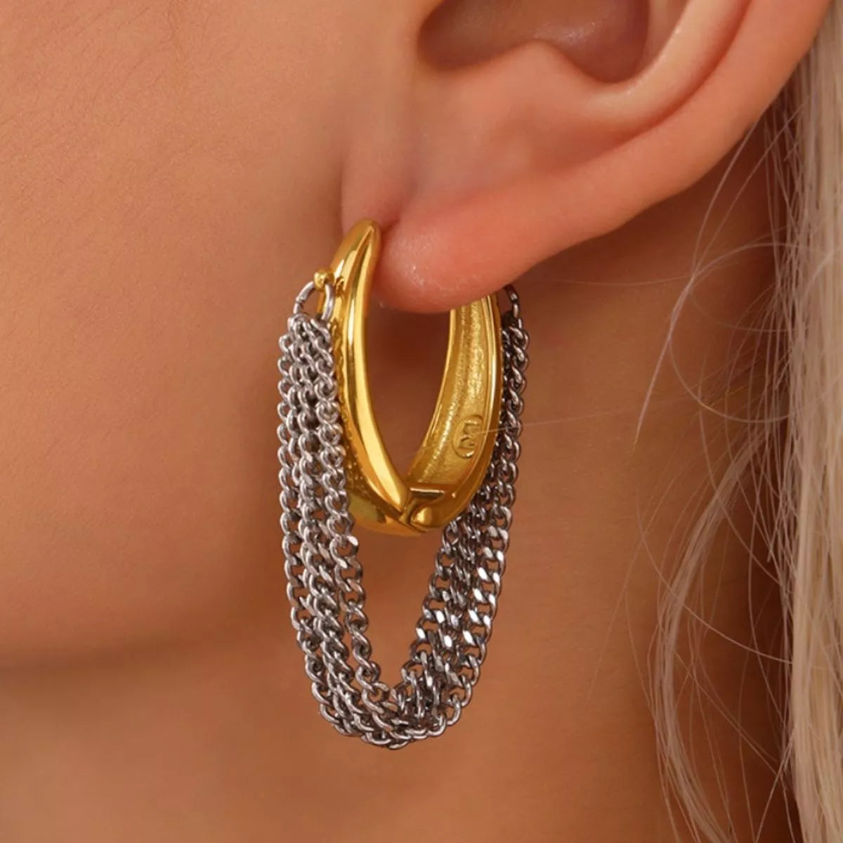 Gold chunky hoop earrings with layered silver chains