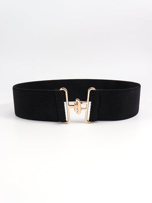 Black elastic belt with a gold sculpted buckle closure
