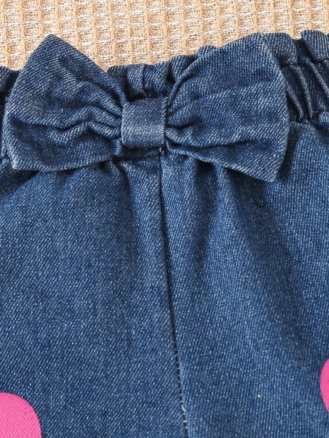 Denim shorts with elastic waist and bow detail