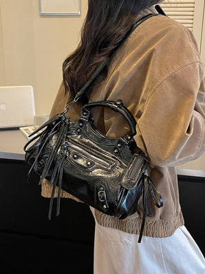 handbag in black with tassels and small