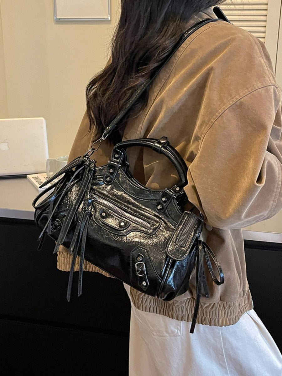 handbag in black with tassels and small