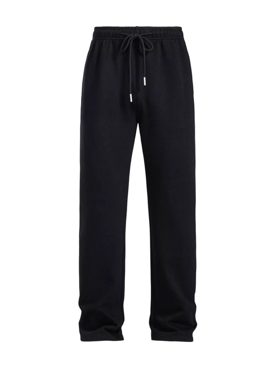 Men's black drawstring loose fit sweatpants with elastic waistband and metal-tipped cord.