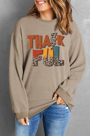 Textured ribbed camel sweatshirt with "Thankful" graphic featuring leopard print and colorful letters.