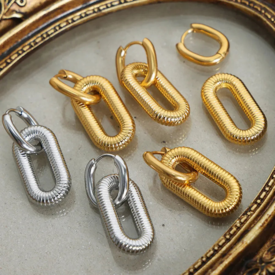 Textured oval link earrings in gold and silver, 18K gold-plated.