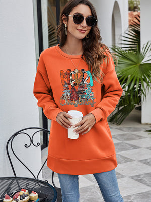 Orange extended hemline sweatshirt with festive graphic and crew neck.