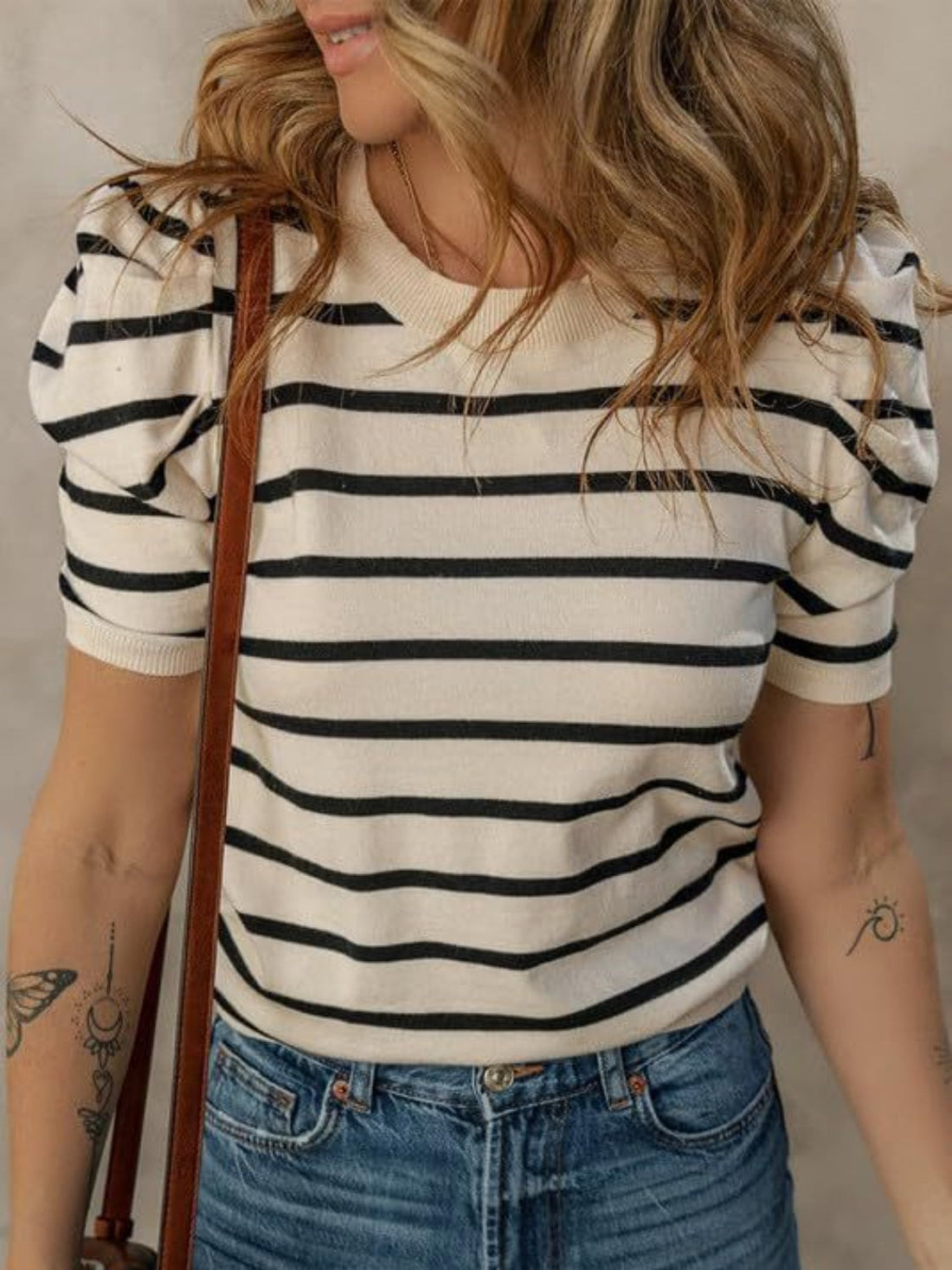 Striped knit tee with puff sleeves in cream and black, crewneck, short sleeves.