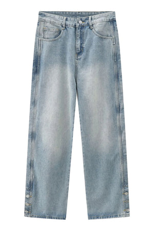 Medium wash baggy denim jeans with snap button hem detail
