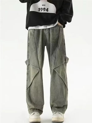 Vintage-inspired wide-leg cargo jeans in washed grey denim with unique paneling and large cargo pockets.
