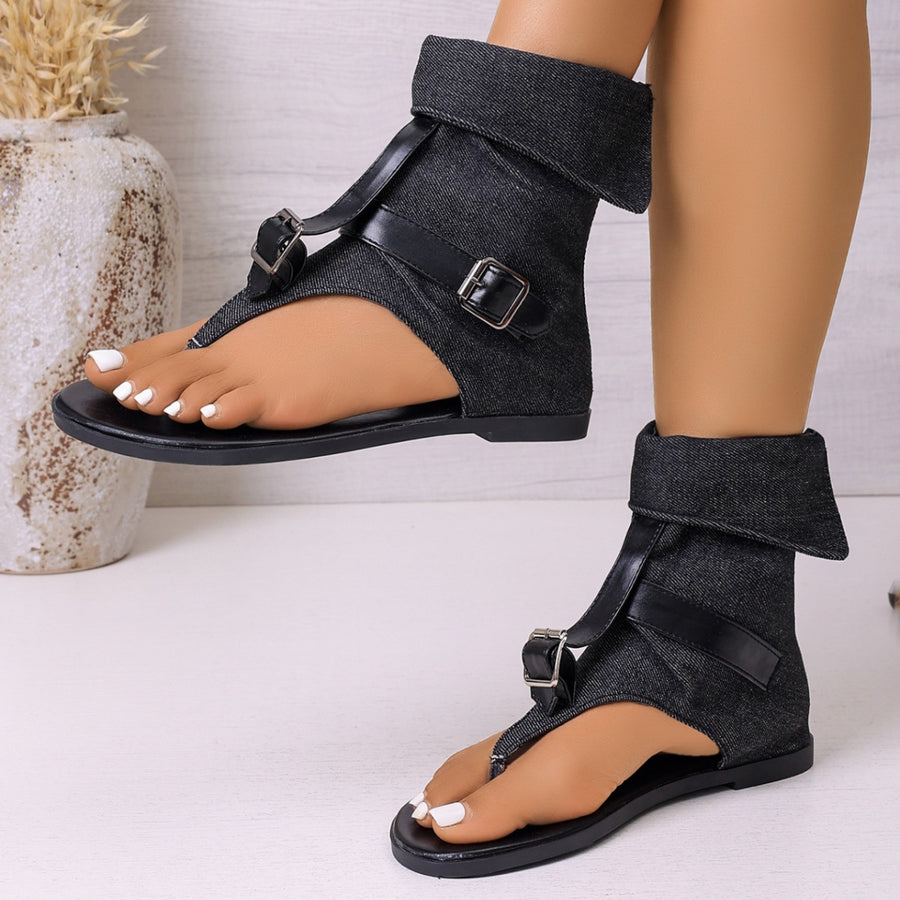 Denim ankle cuff sandals with black buckle straps and a thong toe.