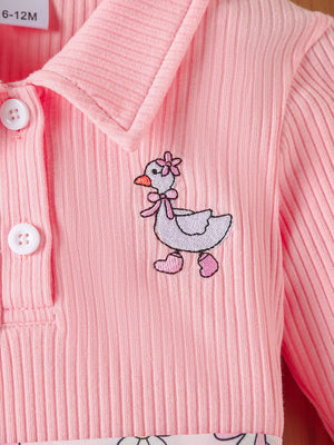 Blush pink ribbed polo with embroidered duck detail and button placket.